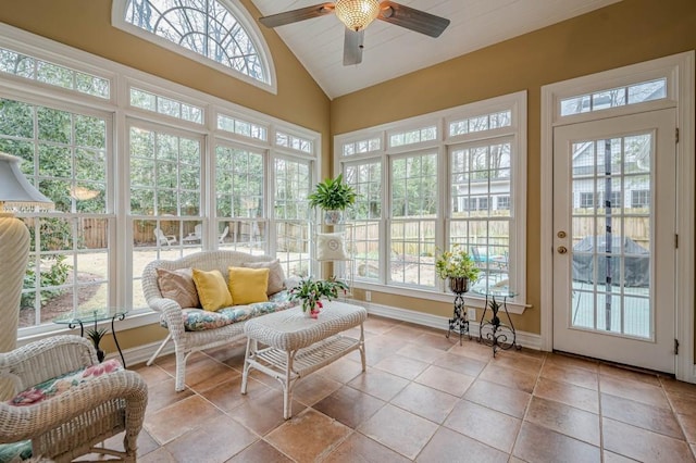 sunroom / solarium featuring lofted ceiling and ceiling fan