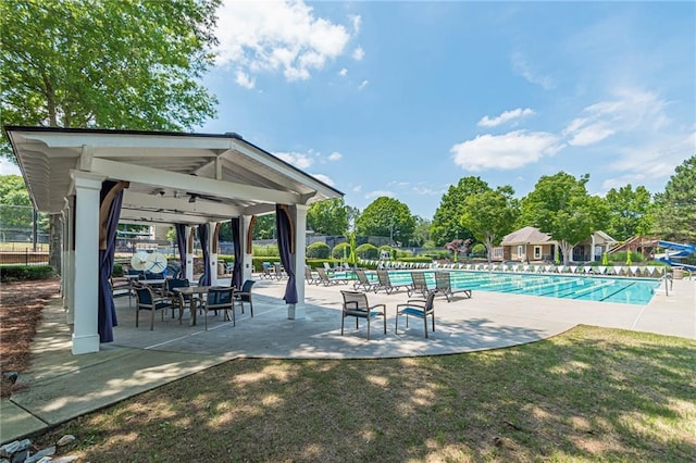 pool with a gazebo, a patio, and fence