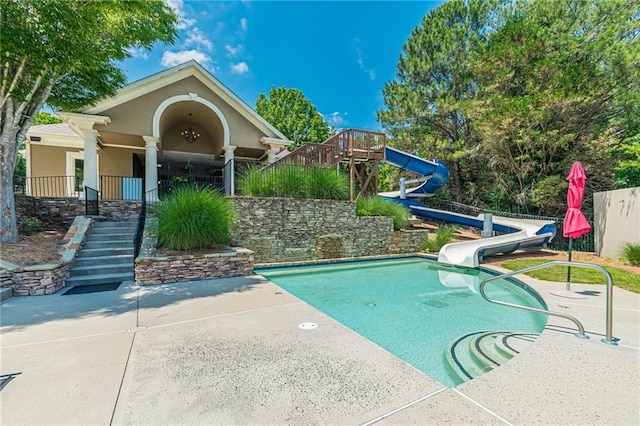 view of swimming pool with stairs