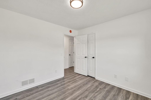 716 Phillips Dr, Monroe, GA 30656 - unfurnished room with wood finished floors and baseboards