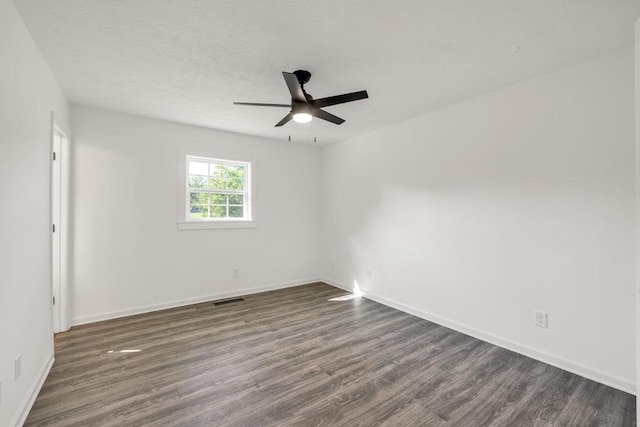 716 Phillips Dr, Monroe, GA 30656 - unfurnished room featuring dark wood finished floors, ceiling fan, and baseboards