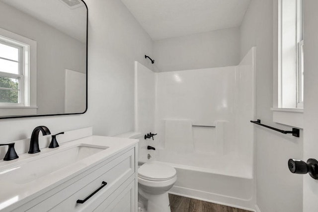 716 Phillips Dr, Monroe, GA 30656 - full bathroom with toilet, shower / washtub combination, wood finished floors, and vanity