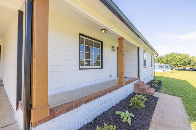 716 Phillips Dr, Monroe, GA 30656 - property entrance with a yard and a porch