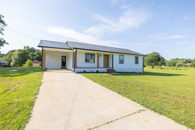 716 Phillips Dr, Monroe, GA 30656 - view of front of property featuring driveway, a front lawn, a carport, crawl space, and metal roof