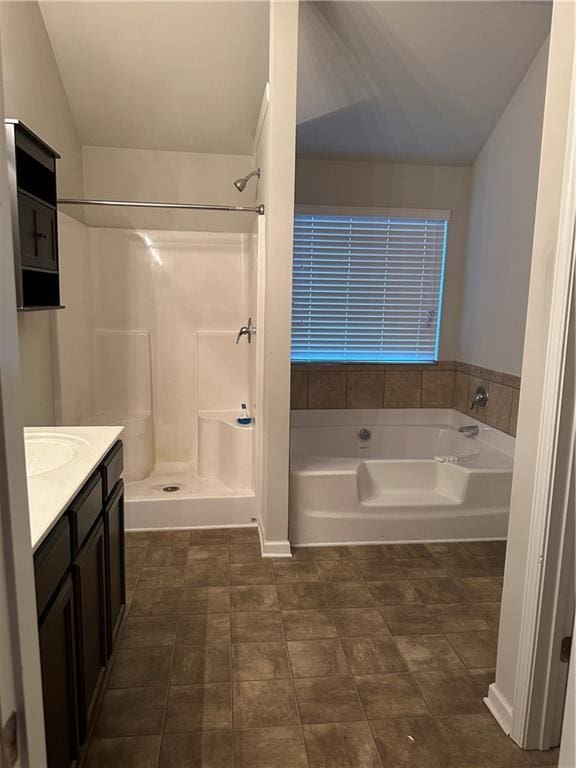 5752 Little River Rd, Atlanta, GA 30349 - bathroom with vanity, a garden tub, a shower, and tile patterned flooring