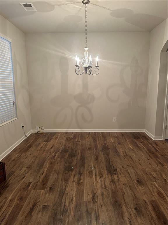 5752 Little River Rd, Atlanta, GA 30349 - unfurnished dining area with dark wood-style floors and a chandelier