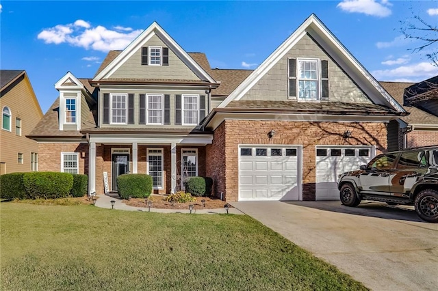 view of front of house featuring a front lawn and a garage