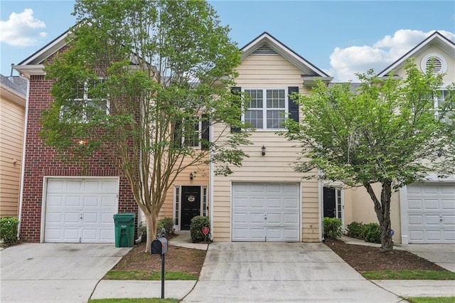 7077 Biltmore Trce, Lithonia, GA 30058 - view of front facade featuring concrete driveway, brick siding, and a garage