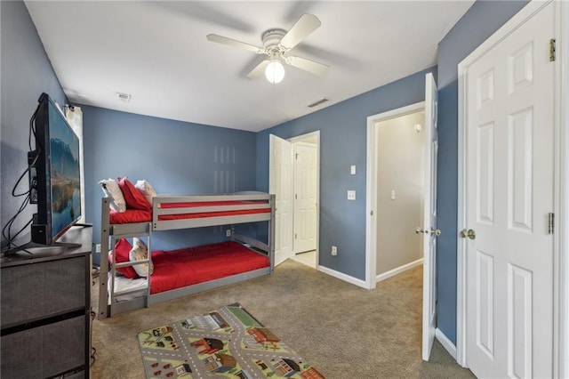 7077 Biltmore Trce, Lithonia, GA 30058 - bedroom with carpet, baseboards, and a ceiling fan
