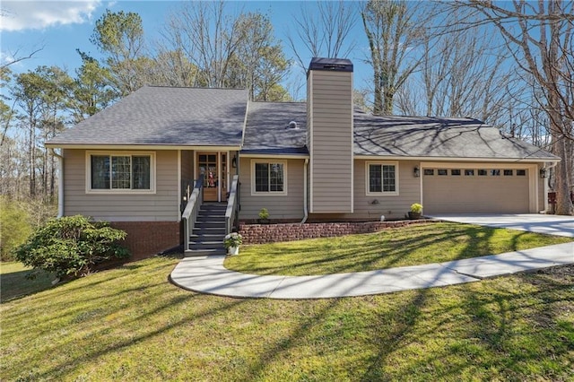 single story home with a chimney, concrete driveway, a garage, and a front yard