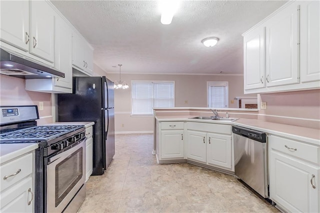 kitchen featuring sink, hanging light fixtures, stainless steel appliances, white cabinets, and kitchen peninsula