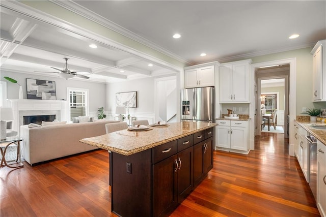 315 Melrose Ave, Decatur, GA 30030 - kitchen featuring dark wood-style flooring, stainless steel appliances, ceiling fan, coffered ceiling, and white cabinets