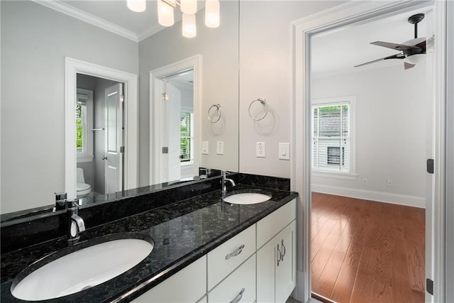 315 Melrose Ave, Decatur, GA 30030 - bathroom featuring toilet, a sink, ornamental molding, and wood finished floors
