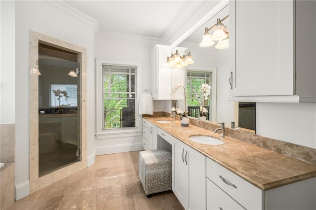 315 Melrose Ave, Decatur, GA 30030 - bathroom with crown molding, double vanity, a sink, and baseboards