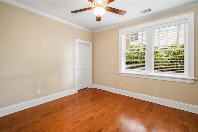 315 Melrose Ave, Decatur, GA 30030 - empty room featuring a ceiling fan, visible vents, baseboards, ornamental molding, and wood finished floors