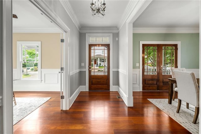 315 Melrose Ave, Decatur, GA 30030 - entryway with crown molding, a chandelier, french doors, a wainscoted wall, and wood finished floors