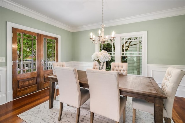 315 Melrose Ave, Decatur, GA 30030 - dining area with crown molding, a wainscoted wall, french doors, and a chandelier