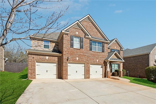 view of front facade with fence, concrete driveway, a front yard, a garage, and brick siding