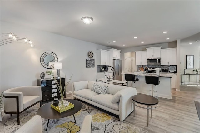 living room with light hardwood / wood-style flooring