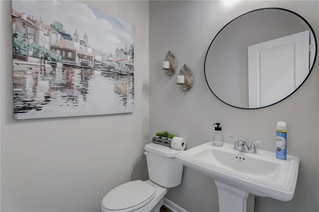 bathroom featuring sink and toilet