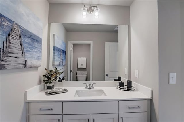 bathroom with vanity and toilet