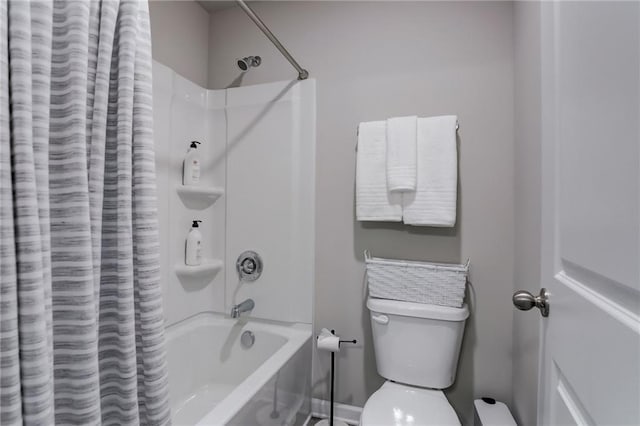 bathroom with shower / bath combination with curtain and toilet