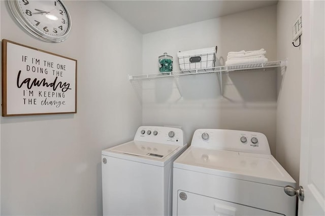 clothes washing area featuring washing machine and dryer