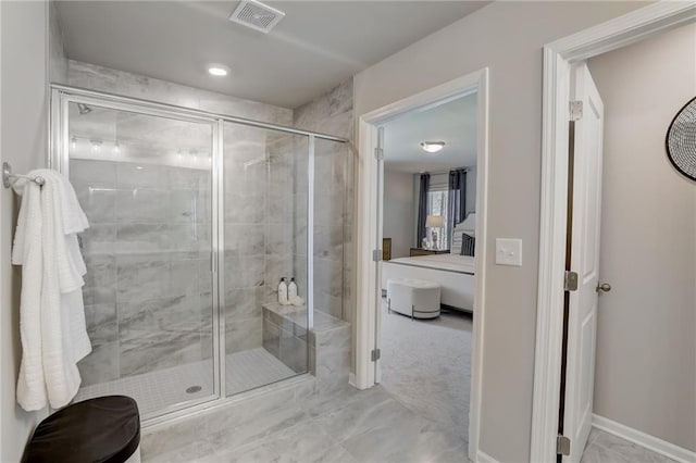 bathroom with a shower with shower door