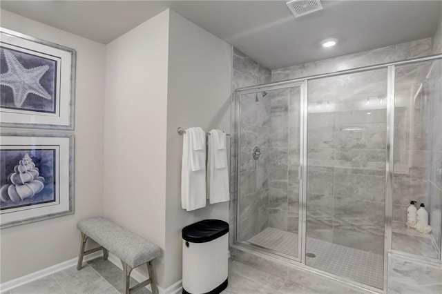 bathroom with tile patterned flooring and a shower with door