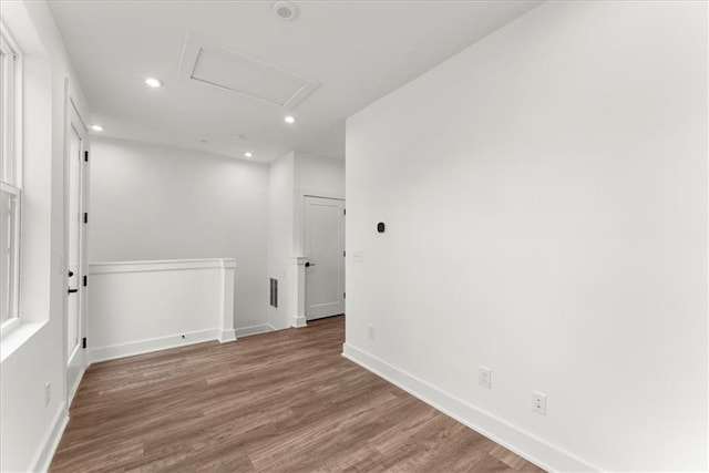 empty room with hardwood / wood-style flooring