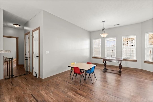 dining room with hardwood / wood-style floors