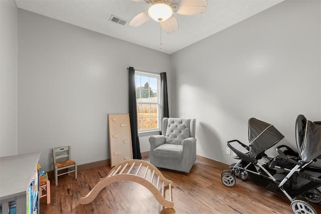 interior space featuring hardwood / wood-style flooring and ceiling fan