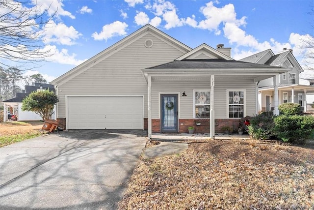 view of front of property featuring a garage and a porch