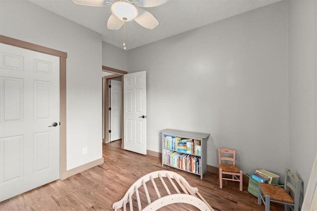 playroom featuring ceiling fan and light hardwood / wood-style floors