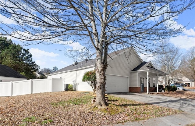 view of side of home featuring a garage