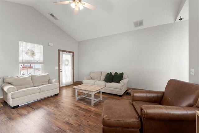 living room with ceiling fan, high vaulted ceiling, and dark wood-type flooring