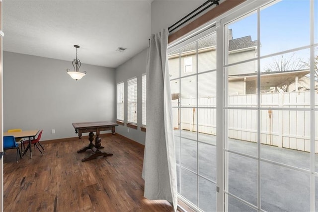 dining room featuring dark hardwood / wood-style flooring and billiards