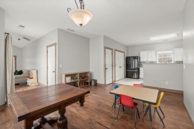 dining area with hardwood / wood-style floors