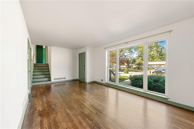 spare room featuring hardwood / wood-style floors