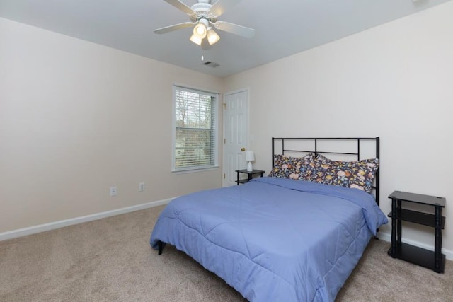 bedroom with a ceiling fan, visible vents, baseboards, and carpet floors