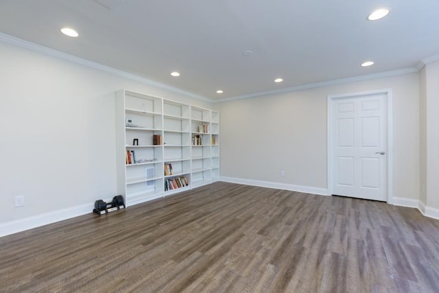 spare room featuring recessed lighting, baseboards, wood finished floors, and ornamental molding