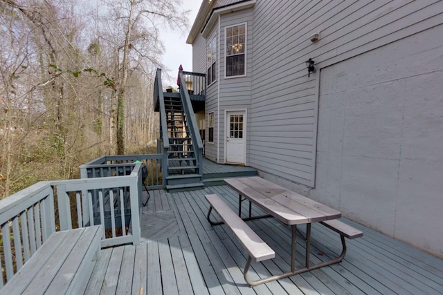 wooden deck featuring stairway