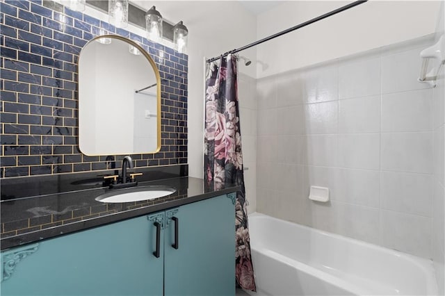 full bath featuring vanity, shower / bathtub combination with curtain, and tasteful backsplash