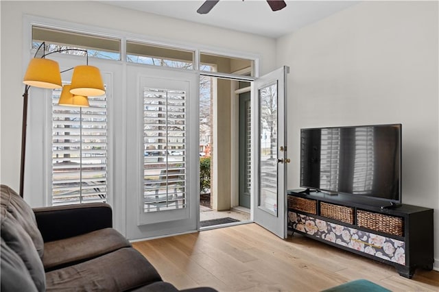 interior space with wood finished floors and ceiling fan