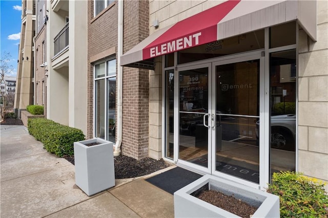 property entrance with brick siding