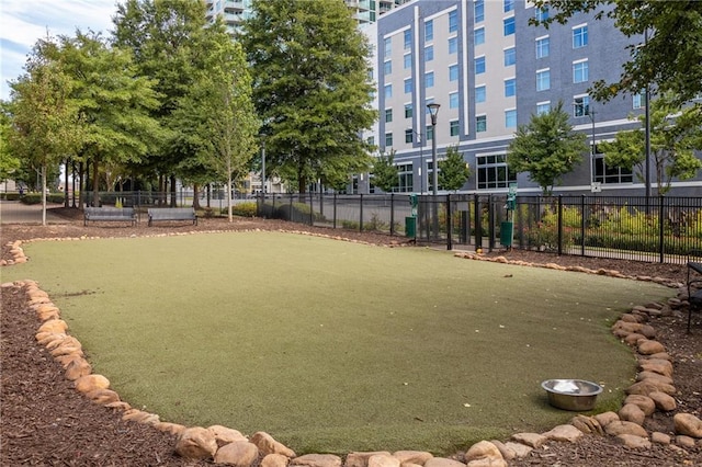 view of property's community with fence