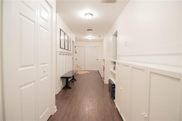 hall with dark hardwood / wood-style flooring