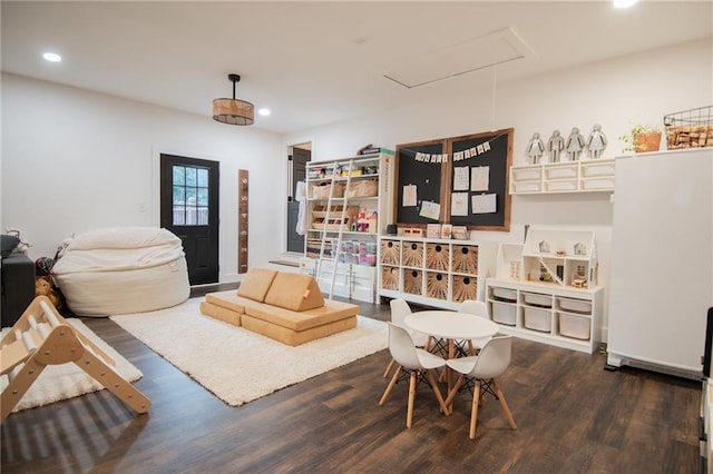 sitting room featuring dark hardwood / wood-style flooring