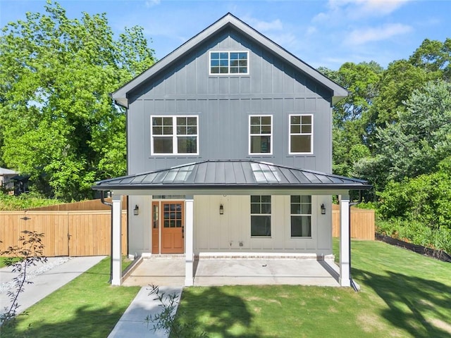 327 Ohm Ave, Avondale Estates, GA 30002 - rear view of house with a standing seam roof, board and batten siding, and metal roof