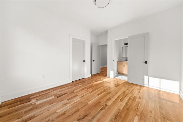 327 Ohm Ave, Avondale Estates, GA 30002 - unfurnished bedroom featuring light wood-type flooring, baseboards, and ensuite bath